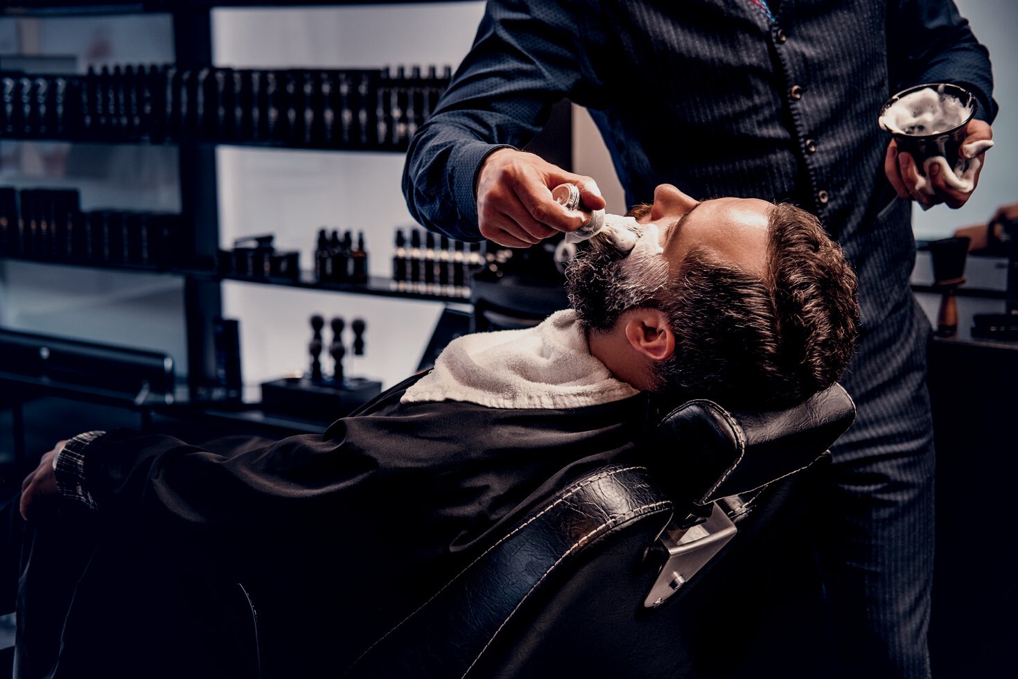 Barber applies shaving foam