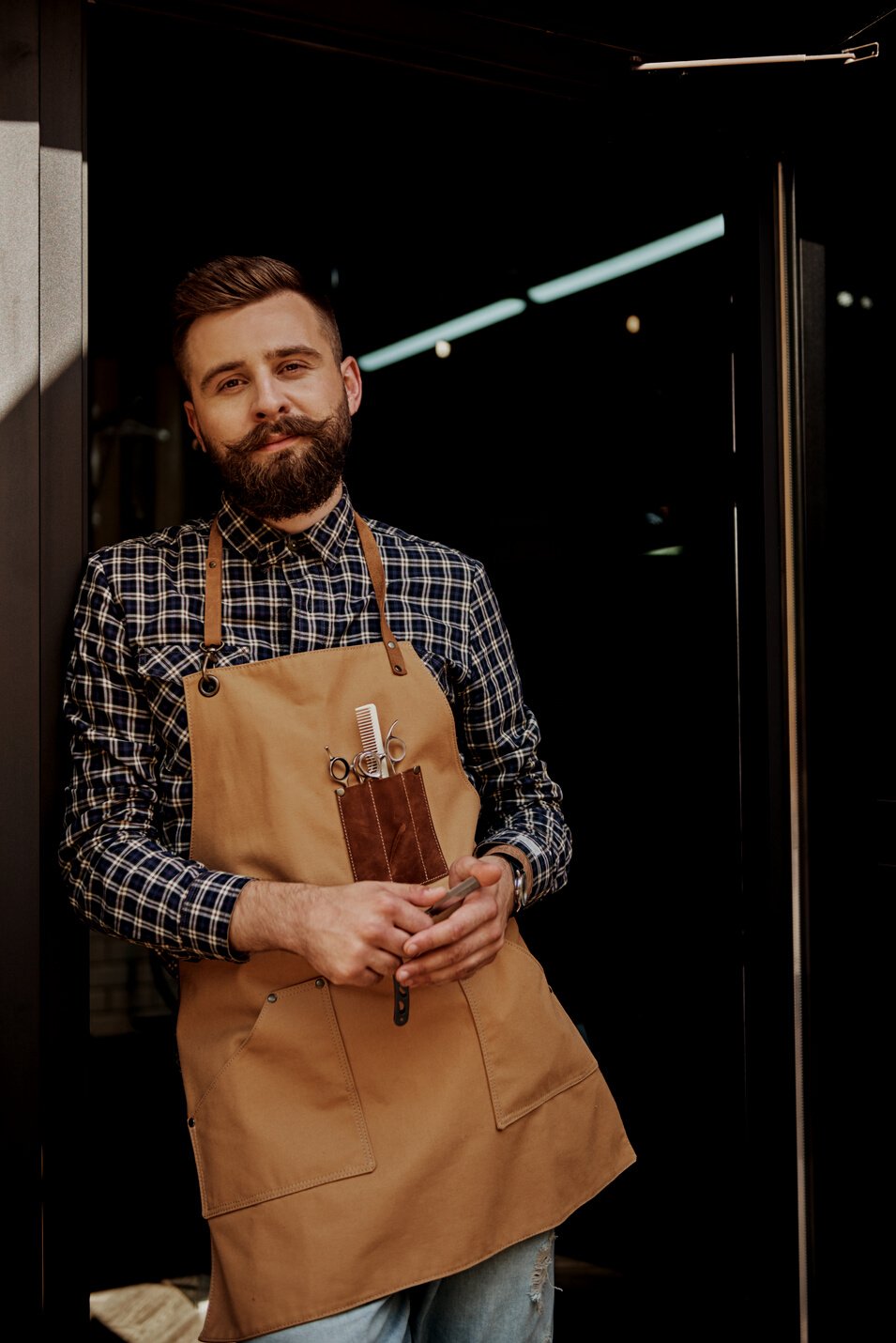 Barber portrait in vintage barber shop