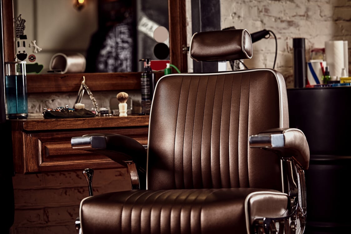 Barbershop armchair. Modern hairdresser and hair salon, barber shop for men.